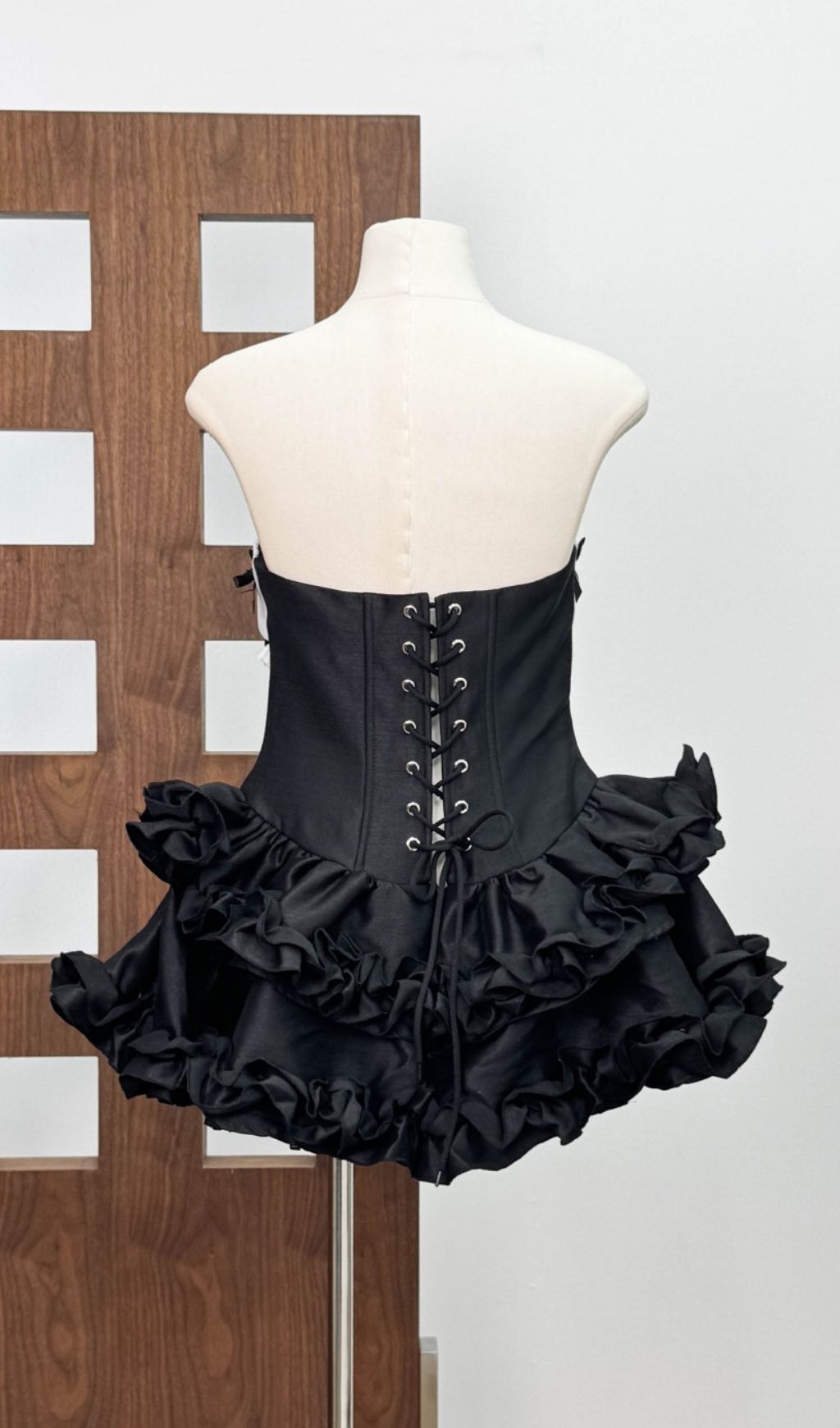 Irca Noir Strapless Corset Mini Dress with Ruffle & Bow Accents
