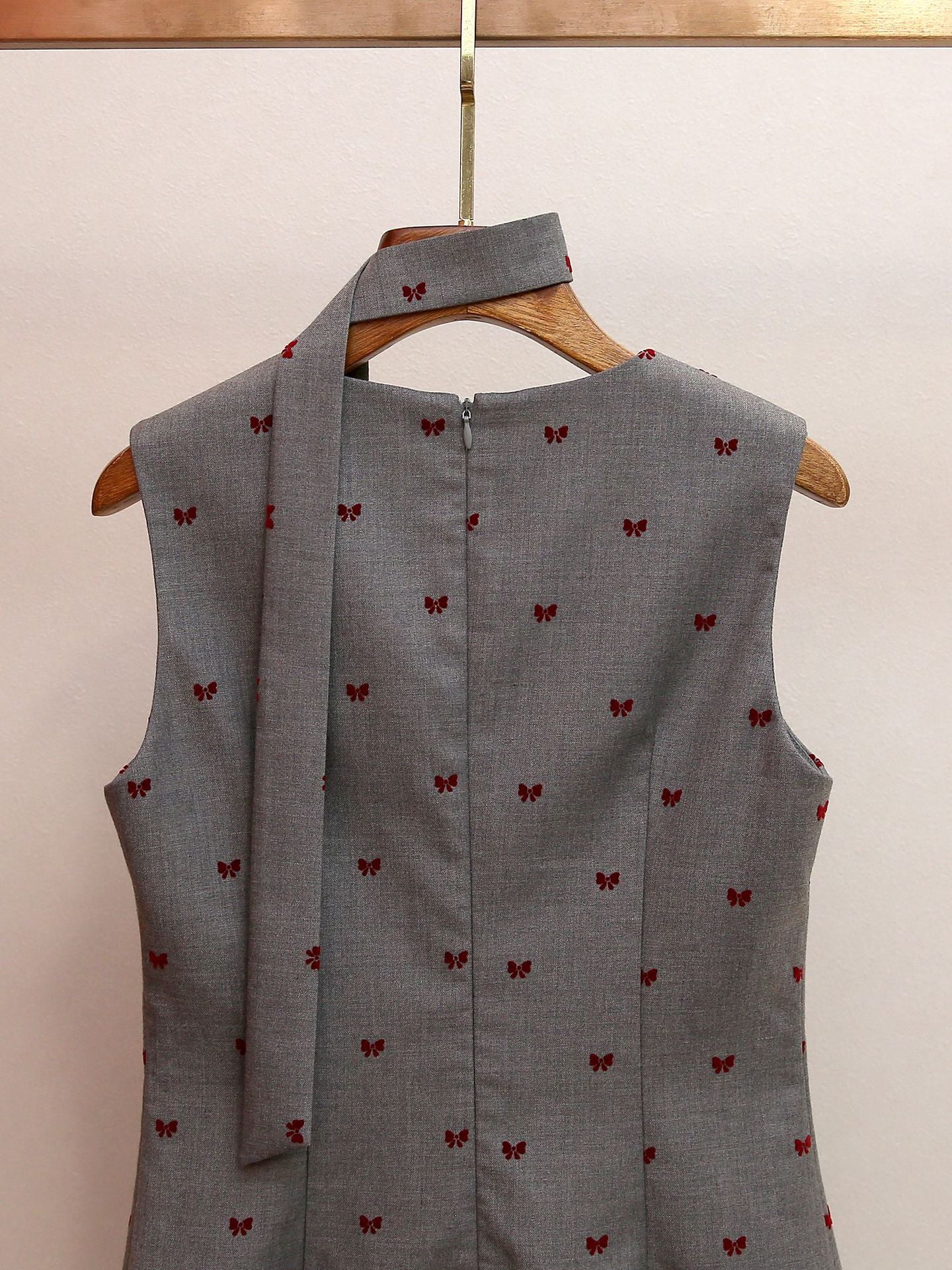 Haruye Playful Bow Print Sleeveless Mini Dress | Scalloped V-Neck & Pleated Hem