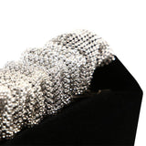 Diamond-studded velvet evening bag.